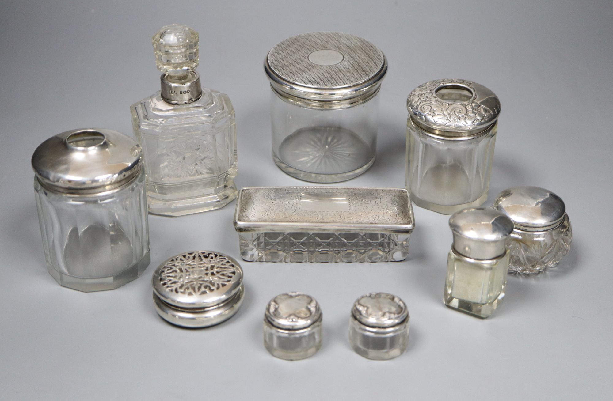 Ten silver top scent bottles